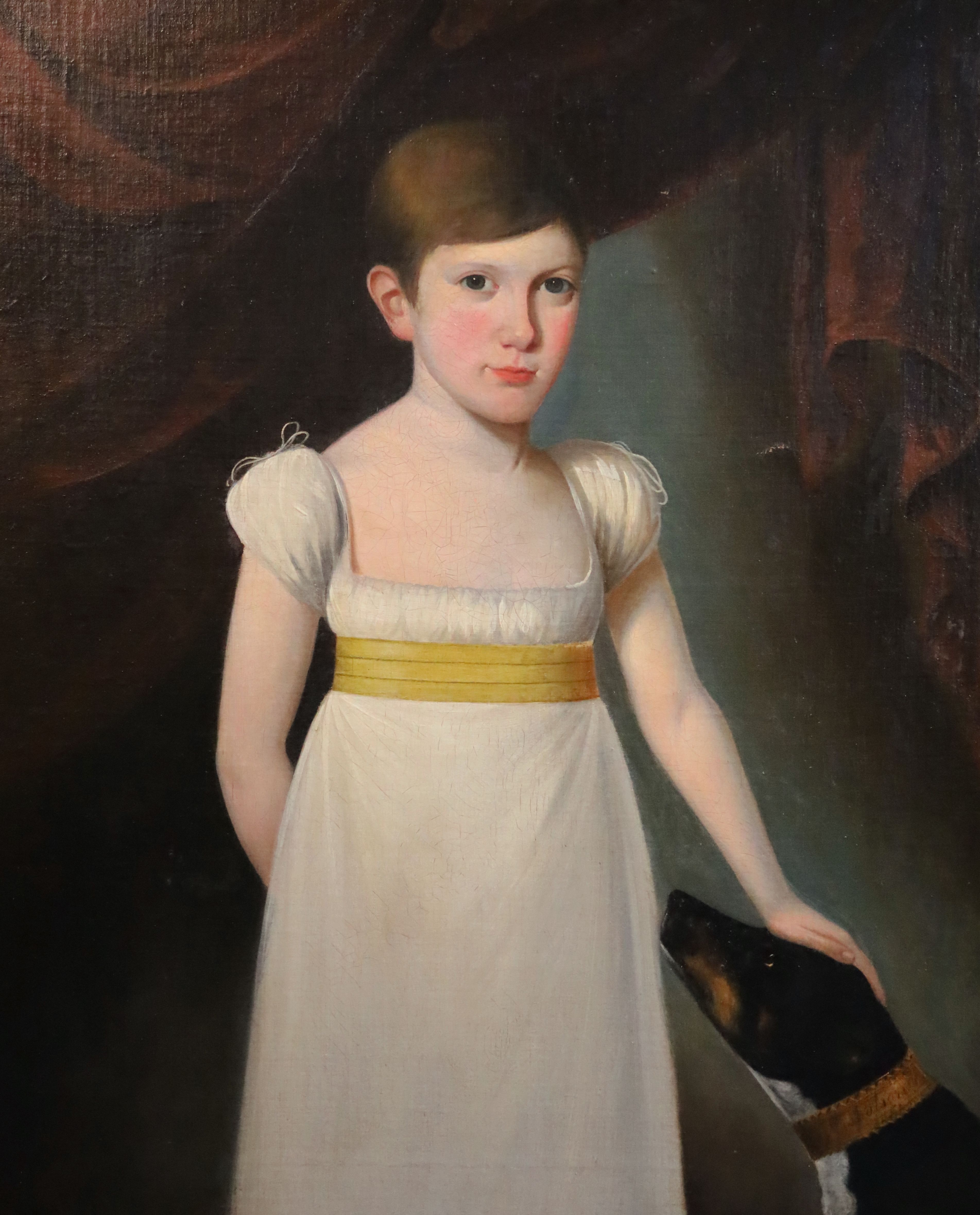 Early 19th century English School Half length portrait of a youth standing with his hand resting upon a dogs head 28.5 x 24in.